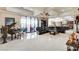 Elegant living room featuring a piano, harp, plush seating, and open floor plan at 8574 Verde Park Cir, Las Vegas, NV 89129