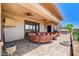 Covered outdoor living space featuring ample seating, ceiling fans, and a hot tub, perfect for relaxing at 8574 Verde Park Cir, Las Vegas, NV 89129