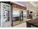 Pantry featuring stainless steel refrigerator and plenty of shelving at 8574 Verde Park Cir, Las Vegas, NV 89129
