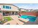 Outdoor swimming pool with a spa and covered patio featuring outdoor furniture at 8955 Ruby Moon Dr, Las Vegas, NV 89139