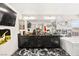 Modern bathroom featuring a double vanity, jacuzzi tub, and black marble floors at 8955 Ruby Moon Dr, Las Vegas, NV 89139