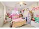 bedroom decorated with a canopy bed and stuffed animals at 8955 Ruby Moon Dr, Las Vegas, NV 89139