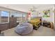 Bedroom with large bed, grey dresser, and open window with blinds at 8955 Ruby Moon Dr, Las Vegas, NV 89139