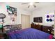 Bedroom featuring carpet flooring, a ceiling fan, an organized closet, and a comfortable bed at 8955 Ruby Moon Dr, Las Vegas, NV 89139