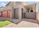 Stylish home with a brick driveway, two-car garage and gated access at 8955 Ruby Moon Dr, Las Vegas, NV 89139