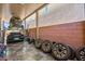 Organized garage with a car lift and ample space for vehicles and storage at 8955 Ruby Moon Dr, Las Vegas, NV 89139