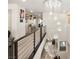 Upstairs hallway with modern chandelier over stairs at 8955 Ruby Moon Dr, Las Vegas, NV 89139