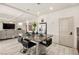 Bright kitchen featuring a granite island with seating, stainless steel appliances, and an open floor plan at 8955 Ruby Moon Dr, Las Vegas, NV 89139
