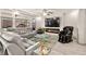 Comfortable living room with a linear fireplace, large leather sofa and accent decor at 8955 Ruby Moon Dr, Las Vegas, NV 89139
