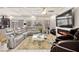 Spacious living room with recessed lights, large TV, fireplace and modern decor at 8955 Ruby Moon Dr, Las Vegas, NV 89139