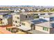 Aerial view overlooking a dense neighborhood with homes, many of which feature solar panels at 8955 Ruby Moon Dr, Las Vegas, NV 89139
