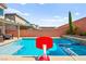 Inviting pool with a basketball hoop for added fun, perfect for outdoor entertainment at 8955 Ruby Moon Dr, Las Vegas, NV 89139