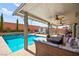 Inviting poolside patio with a covered area, ideal for relaxing and entertaining guests at 8955 Ruby Moon Dr, Las Vegas, NV 89139