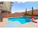 Sparkling pool with a Baja shelf, ideal for lounging and enjoying the sunny outdoors at 8955 Ruby Moon Dr, Las Vegas, NV 89139