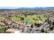 Golf course with mature trees and bodies of water, creating a resort-like feel at 9912 Woodhouse Dr, Las Vegas, NV 89134