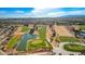 Aerial view of the golf course with ponds and desert landscaping at 9912 Woodhouse Dr, Las Vegas, NV 89134
