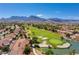 Aerial view of the golf course with mountain views in the background at 9912 Woodhouse Dr, Las Vegas, NV 89134
