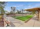 Outdoor bocce ball courts are shown with benches to view play at 9912 Woodhouse Dr, Las Vegas, NV 89134