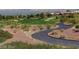 Winding cart path through the golf course with city views in the distance at 9912 Woodhouse Dr, Las Vegas, NV 89134
