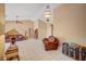 Spacious living room with tile flooring, chandelier, and ceiling fan features plenty of space for relaxation at 9912 Woodhouse Dr, Las Vegas, NV 89134