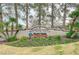 Attractive Palm Valley Golf Club signage with lush landscaping and mature trees at 9912 Woodhouse Dr, Las Vegas, NV 89134