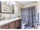 Cozy bathroom with a single sink vanity and a shower with patterned curtains at 1001 Sulphur Springs Ln # 202, Las Vegas, NV 89128