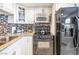 Kitchen with white cabinets, stainless steel appliances, and granite countertops at 1001 Sulphur Springs Ln # 202, Las Vegas, NV 89128