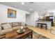 Cozy living room showcasing an open layout to the kitchen and dining area, ideal for entertaining at 1001 Sulphur Springs Ln # 202, Las Vegas, NV 89128