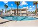 Exterior view of a community pool surrounded by palm trees, perfect for relaxation and outdoor enjoyment at 1001 Sulphur Springs Ln # 202, Las Vegas, NV 89128