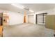 A bonus room area featuring neutral carpeting and access to a closet and the kitchen at 10445 Schirlls St, Las Vegas, NV 89141
