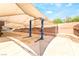 A carport with a two-post car lift and an extended awning at 10445 Schirlls St, Las Vegas, NV 89141