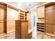 Walk-in closet with built-in shelving, drawers, and ample storage space at 10445 Schirlls St, Las Vegas, NV 89141