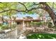 Charming exterior view of townhome featuring a walkway, cozy porch, and well-maintained greenery at 10445 Schirlls St, Las Vegas, NV 89141