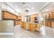 Spacious kitchen with stainless steel appliances, a center island, and tile flooring at 10445 Schirlls St, Las Vegas, NV 89141