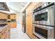 Close up of stainless steel appliances and custom cabinetry in modern kitchen at 10445 Schirlls St, Las Vegas, NV 89141