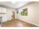 The kitchen with laminate flooring boasts a window view of greenery at 10445 Schirlls St, Las Vegas, NV 89141