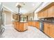 Modern kitchen features stainless appliances, center island, and granite countertops at 10445 Schirlls St, Las Vegas, NV 89141