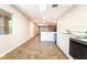 An open floor plan kitchen with an island and laminate flooring at 10445 Schirlls St, Las Vegas, NV 89141