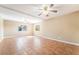 A large living area with tile flooring, neutral paint, and multiple ceiling fans at 10445 Schirlls St, Las Vegas, NV 89141