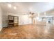 Expansive living room featuring tile flooring, ceiling fan, and a seamless transition to dining area at 10445 Schirlls St, Las Vegas, NV 89141