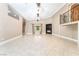 Large living room with fireplace, and access to a second story catwalk with decorative wrought iron at 10445 Schirlls St, Las Vegas, NV 89141