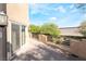 Enjoy outdoor living on this patio with a view of desert landscaping and a private entry door at 10445 Schirlls St, Las Vegas, NV 89141
