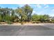 Charming home featuring mature trees and desert-style landscaping, with an inviting curb appeal on a quiet street at 10445 Schirlls St, Las Vegas, NV 89141