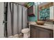 Cozy bathroom featuring a vanity with modern fixtures and a combined shower and bathtub at 1048 Menands Ave, Las Vegas, NV 89123