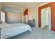 Spacious bedroom featuring neutral carpet, a large window, and an ensuite bathroom for added privacy at 1048 Menands Ave, Las Vegas, NV 89123