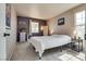 Inviting bedroom with plush carpet, natural light, and tasteful decor, designed for comfort and relaxation at 1048 Menands Ave, Las Vegas, NV 89123