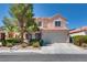 Charming two-story home with a well-maintained front yard and attached two-car garage in a residential neighborhood at 1048 Menands Ave, Las Vegas, NV 89123