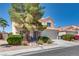 Attractive two-story home with a two-car garage, landscaped front yard, and drought-resistant landscaping at 1048 Menands Ave, Las Vegas, NV 89123