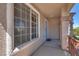 Covered front porch featuring security door and shade, with an inviting entrance and enhanced curb appeal at 1048 Menands Ave, Las Vegas, NV 89123