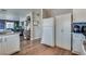 Bright kitchen featuring white cabinets, modern appliances, and a seamless connection to adjacent living spaces at 1048 Menands Ave, Las Vegas, NV 89123